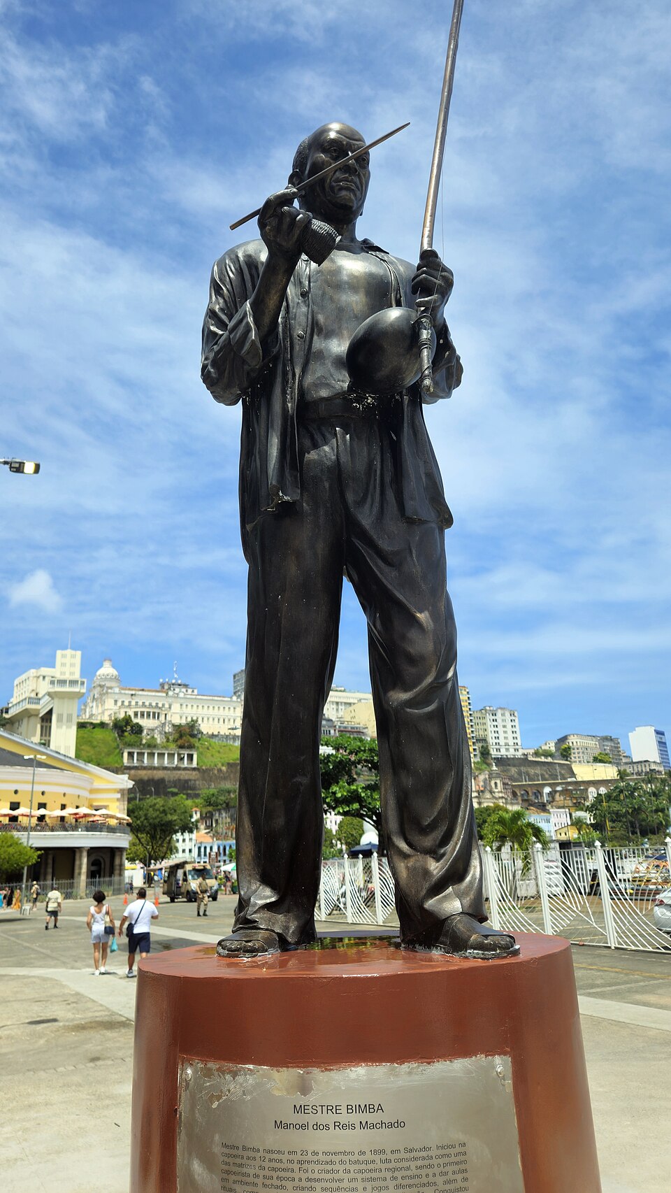 Bronze statue of Mestre Bimba playing berimbau at Arena da Capoeira in Salvador.
